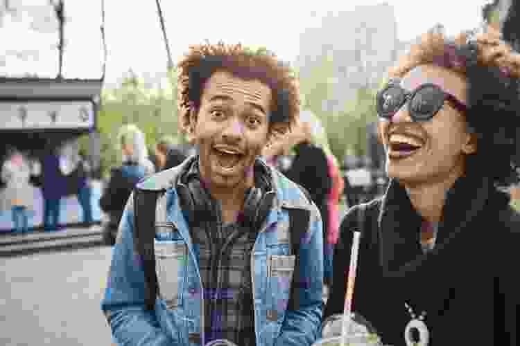 Friends laughing outdoors