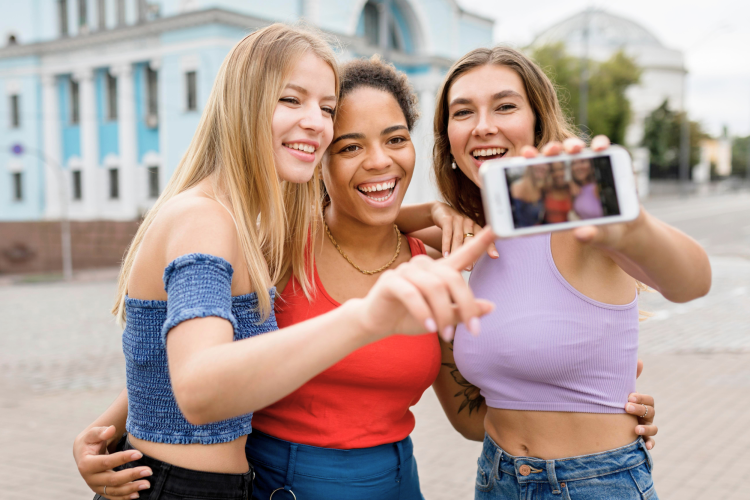 friends wearing casual clothes taking a selfie