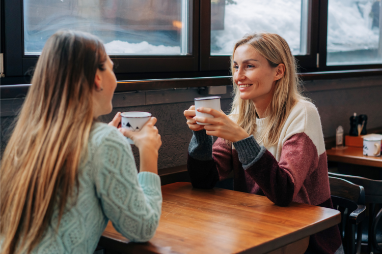 two friends chatting over coffee