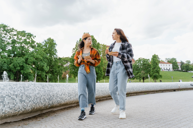 two friends walking and talking