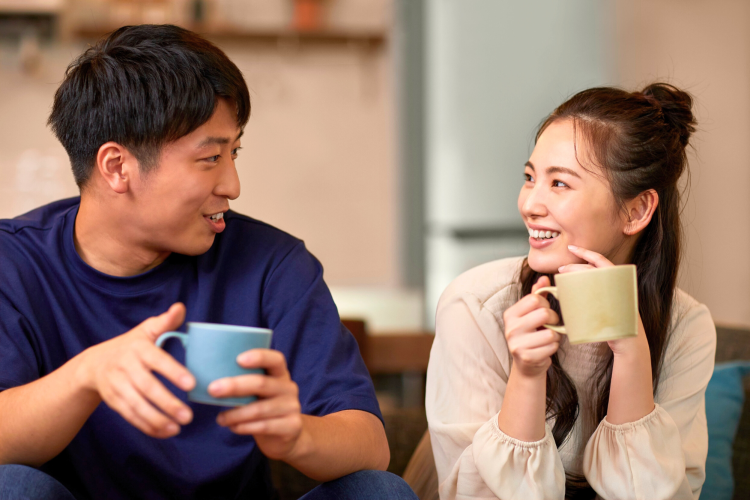 Two friends chatting over a cup of coffee