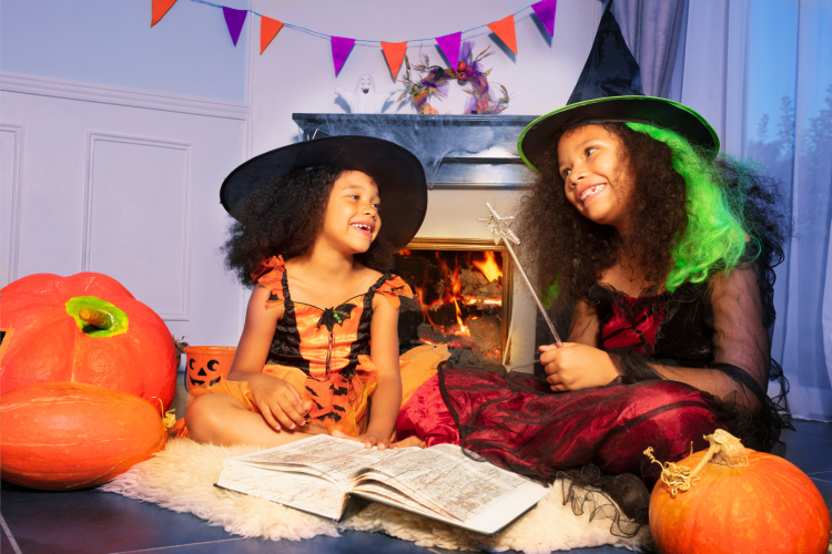 kids dressed as witches laughing together