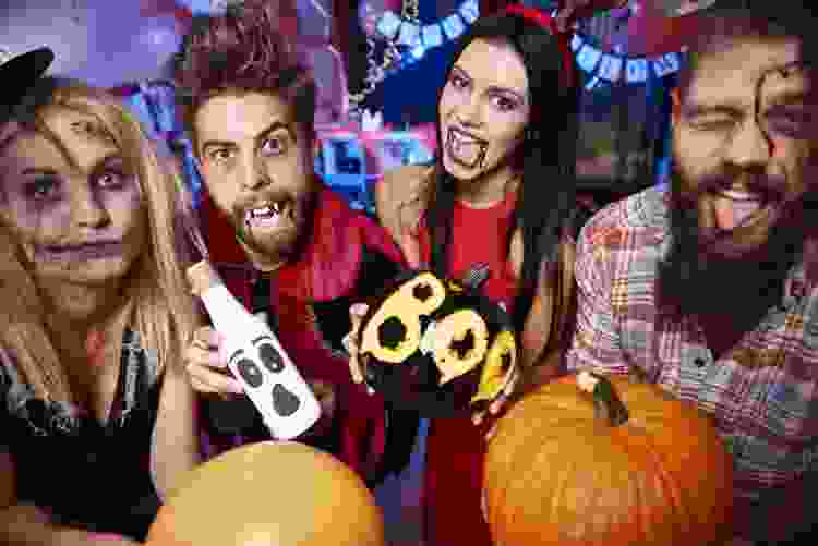 young friends having fun halloween party