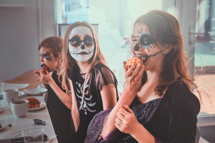 girls dressed up and eating