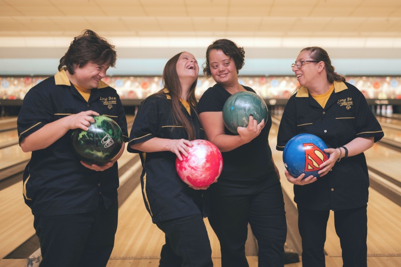 friends bowling together