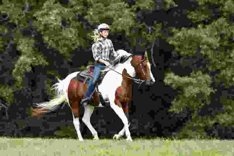 teen riding horseback