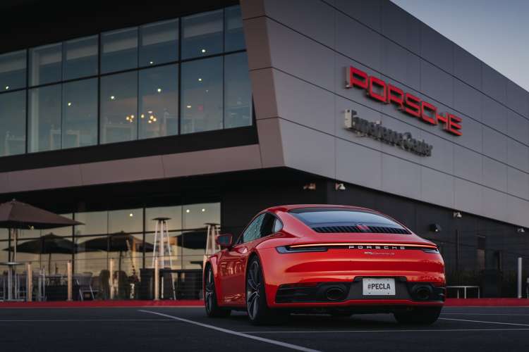 red porsche parked outside the porsche experience in atlanta