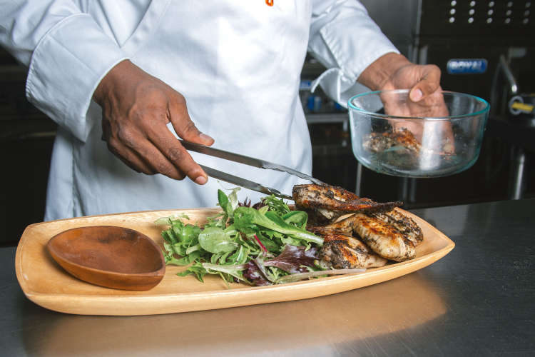 private chef plating a meal