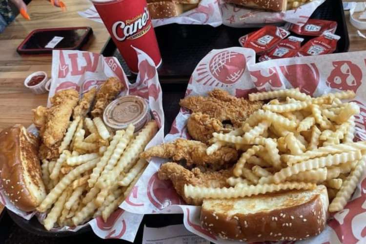 platters of fried chicken strips and crinkle-cut fries