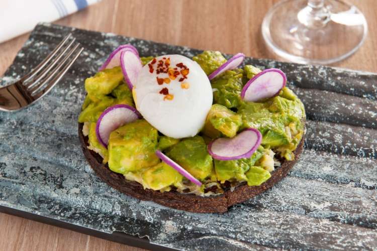 avocado toast with a poached egg on top