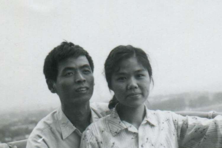 a young couple in the '70s poses for the camera