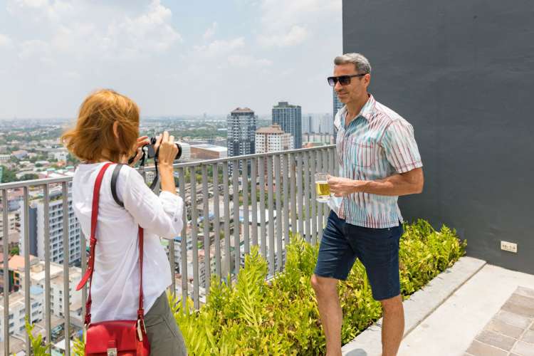 Taking portraits of each other for fun is a cute third date idea.