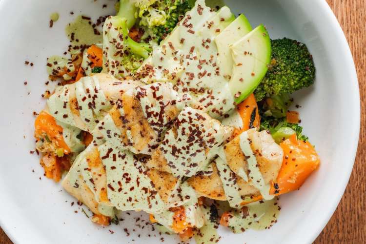 charred broccoli, sweet potato, and white sauce with shaved chocolate