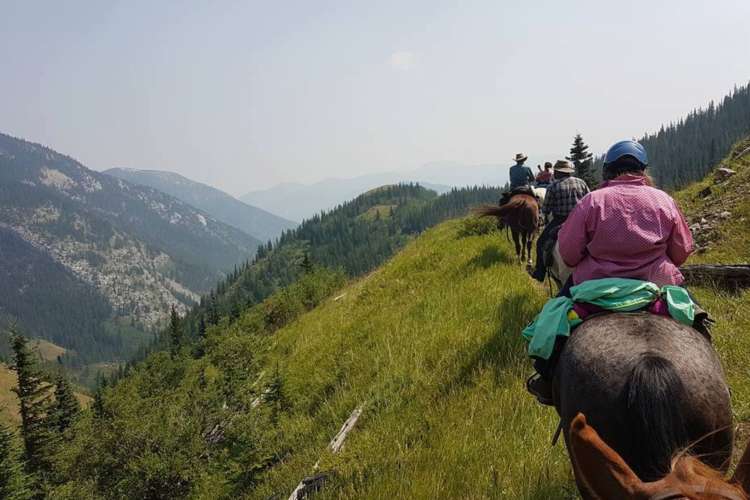 people on horseback in the Canadian Rockies