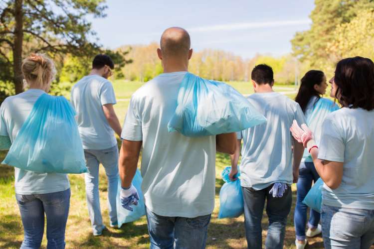 Volunteering is a meaningful team building activity in Omaha.