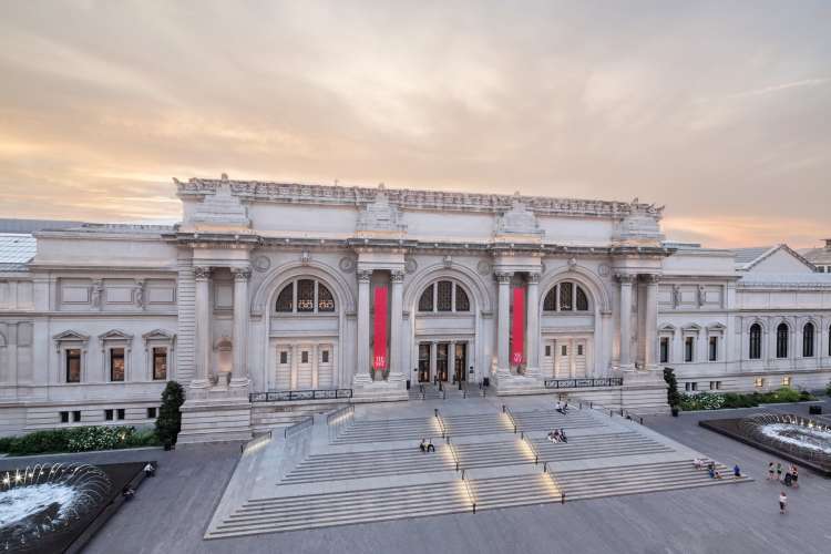 exterior of the metropolitan museum of art in new york city at sunset