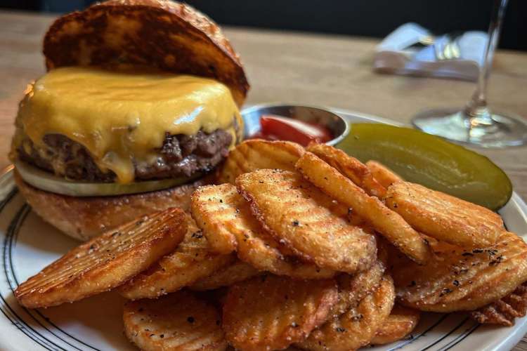 a thick cheeseburger and fries