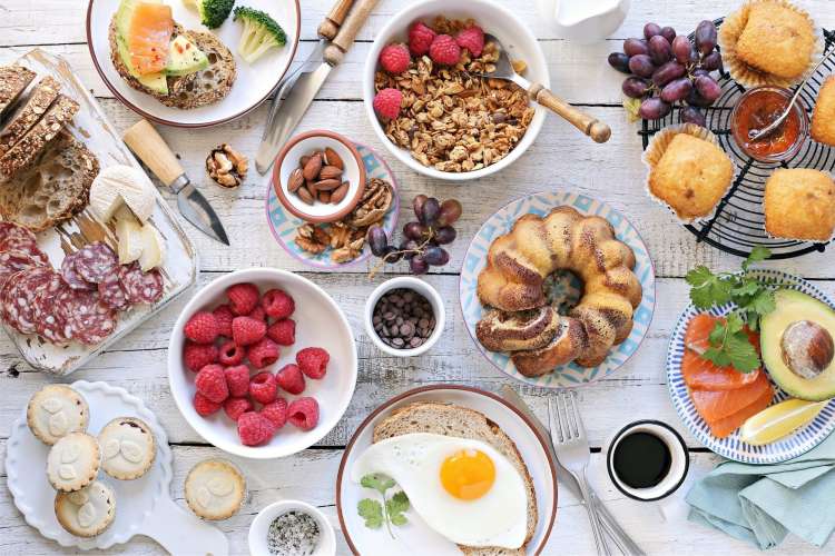 a variety of breakfast foods on a table