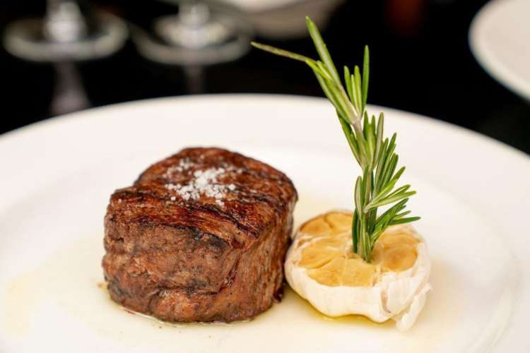 a filet mignon and decorate garnish with rosemary