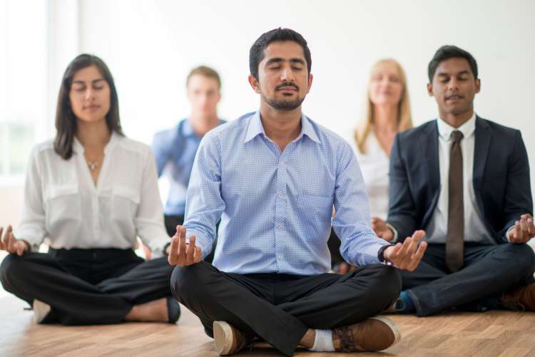 A yoga class is a great team building activity in Detroit.