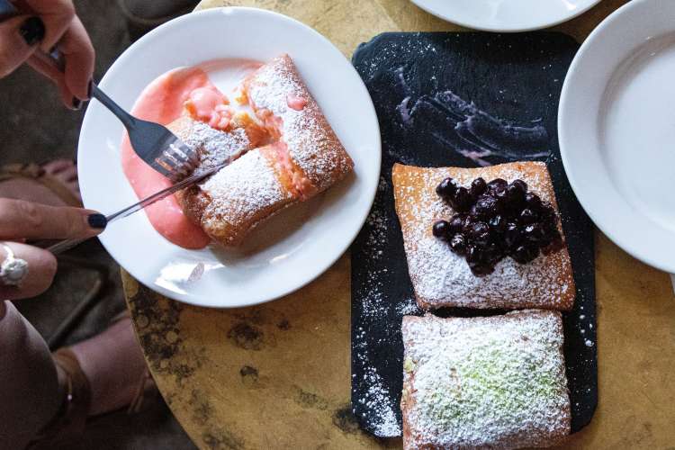 Enjoying beignets on a food tour