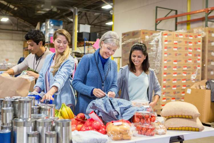 Volunteering is a meaningful team building activity in Orlando.