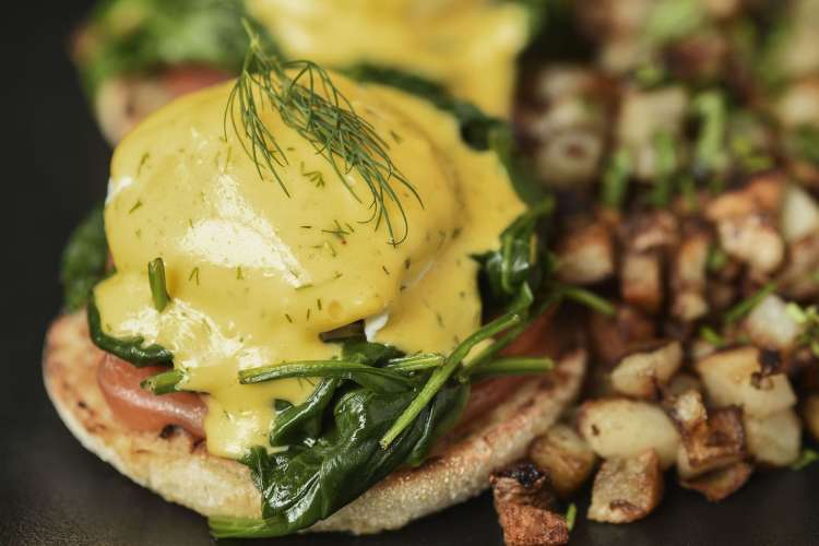 spinach eggs Benedict and roasted potatoes