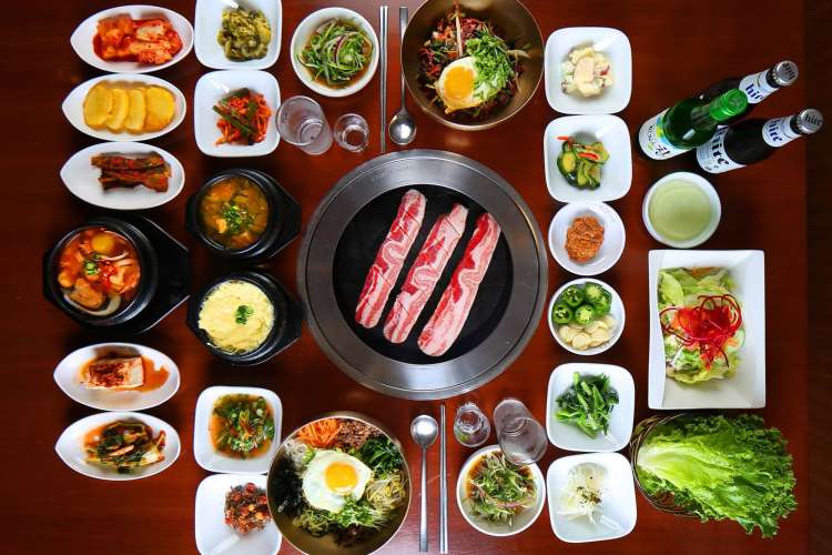 a vast array of sides and drinks with Korean pork belly