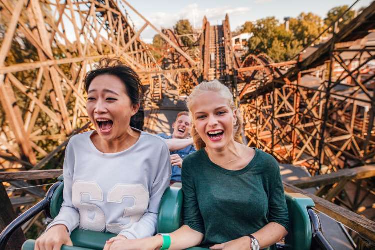 a female couple on a roller coaster