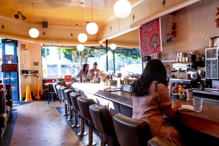 an old-fashioned retro-futuristic diner interior