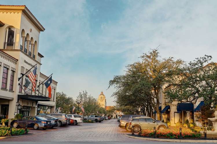 parking lot and exterior of the highland park village shopping complex