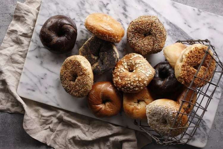 Bagels from Ess-a-Bagel laid out on a marble cutting board