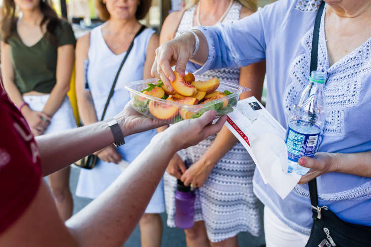 group enjoying food on a walking food tour