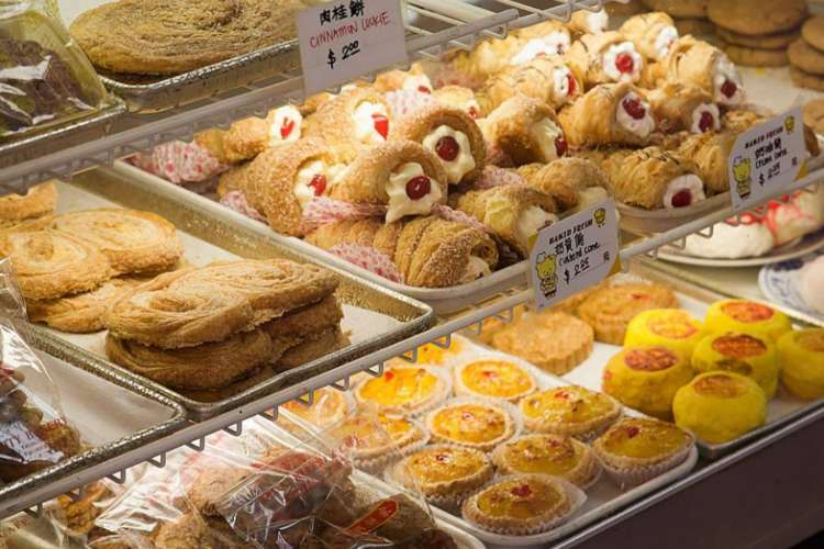 a glass display with various pastries