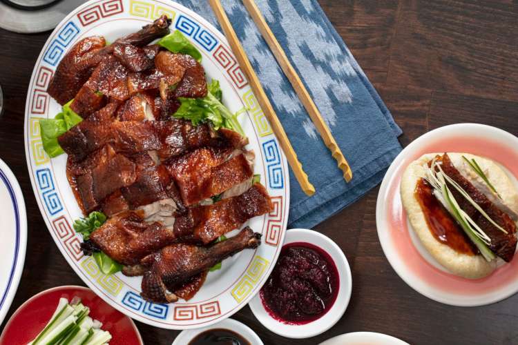 a platter of roasted Peking duck and sides