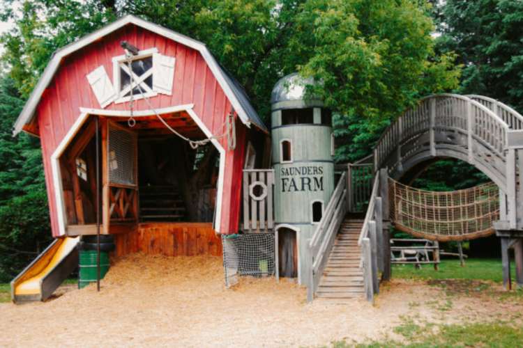 a red barn with a sign reading Saunders Farm