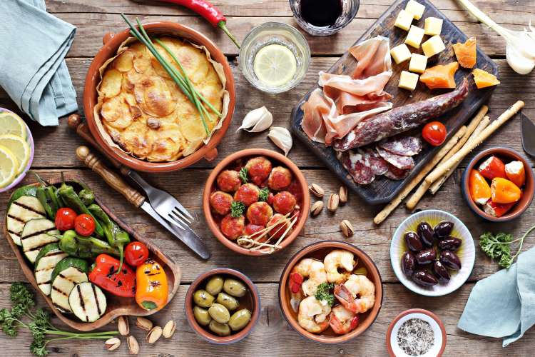 Spanish tapas laid out on a table