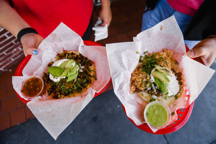 folks enjoying mexican food on a food tour