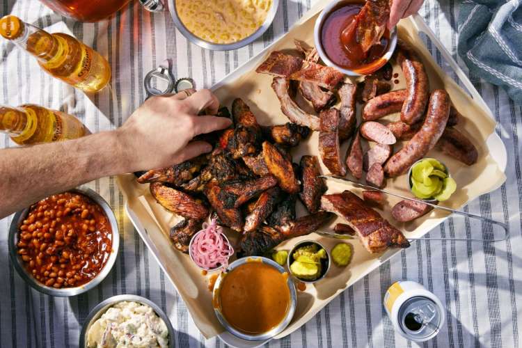 A delicious spread of chicken wings, sausage and more from Fiorella’s Jack Stack Barbecue
