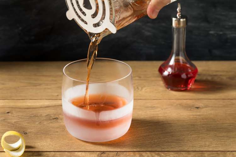 a Sazerac cocktail being prepared