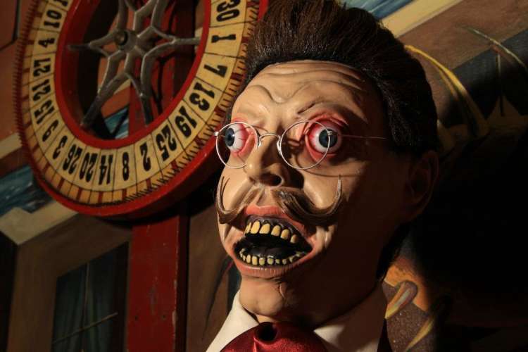 creepy manequin head and roulette wheel at trundle manor