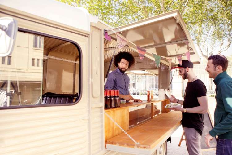 two men ordering food at a food truck