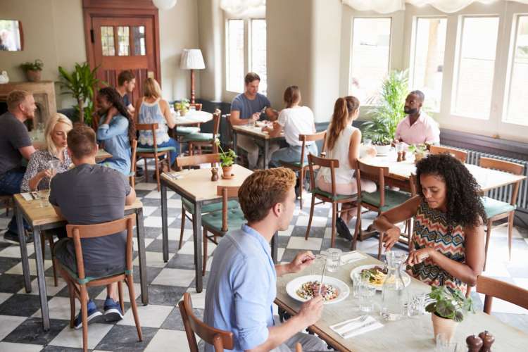 people eating lunch in a crowded restaurant