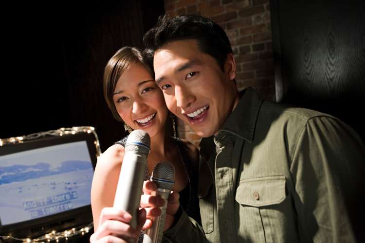 Karaoke is a great date night idea for married couples who love singing.