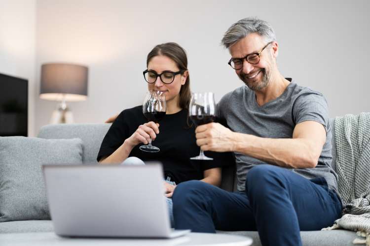 couple enjoying a virtual wine tasting at home