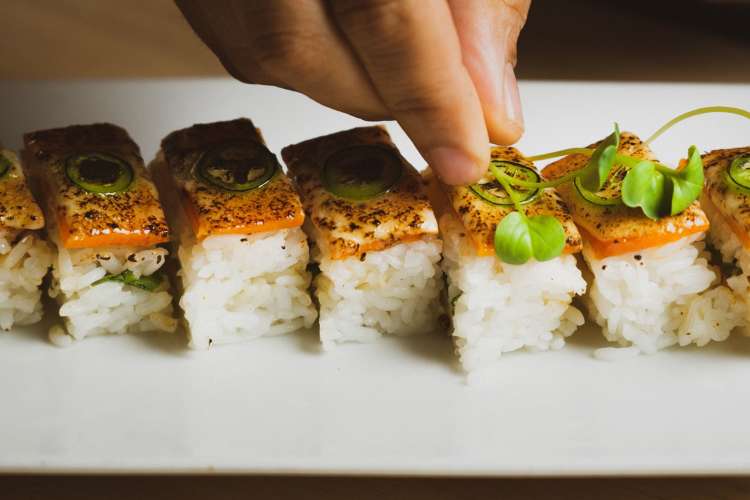 vegan sushi laid artfully on a plate