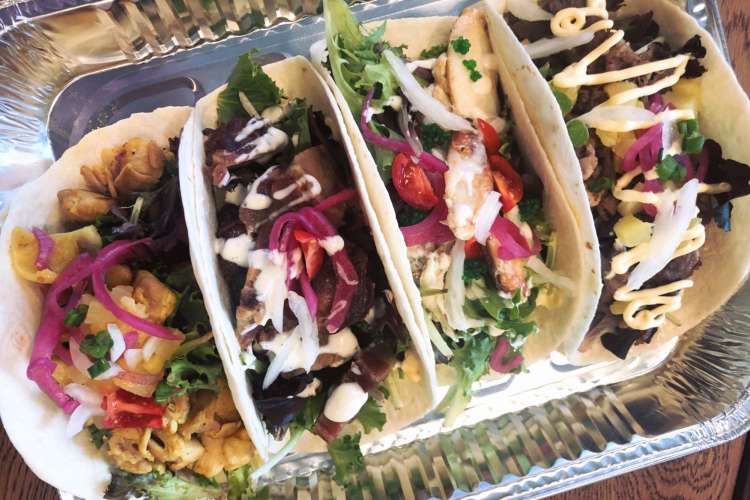 seafood tacos in a takeaway container