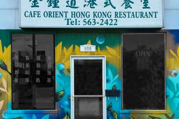 the blue and yellow store front of Cafe Orient