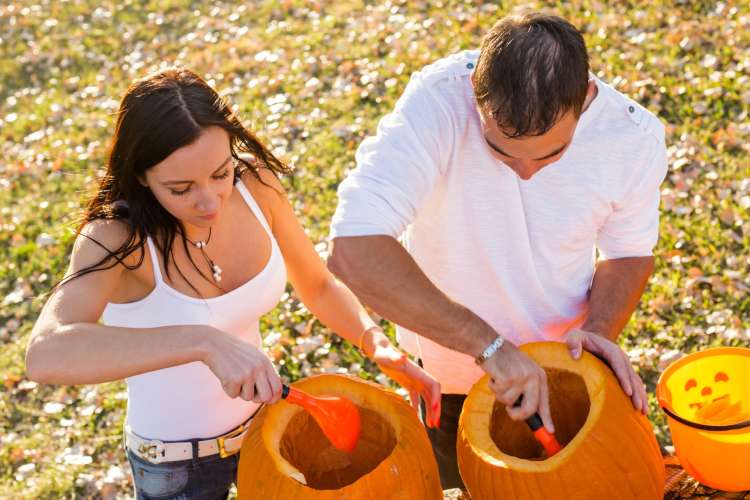 Carving pumpkins is a classic fall date idea.