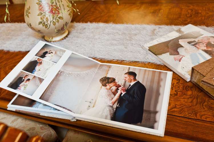 Looking at weddings photos is a meaningful date night idea for married couples. 